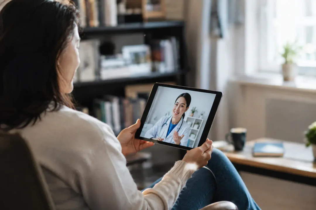 Adult on a video call with a doctor